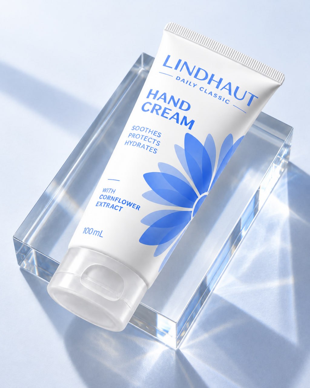 Daily Classic hand cream resting on a clear glass block in soft daylight