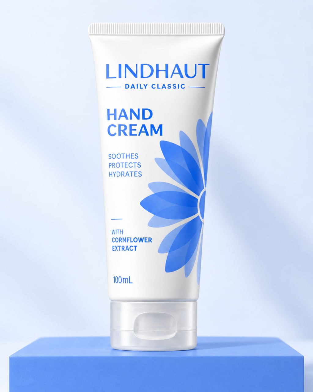 Daily Classic 100 mL hand cream standing on a blue display plinth